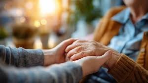 companion with a senior holding hands to show trust and care